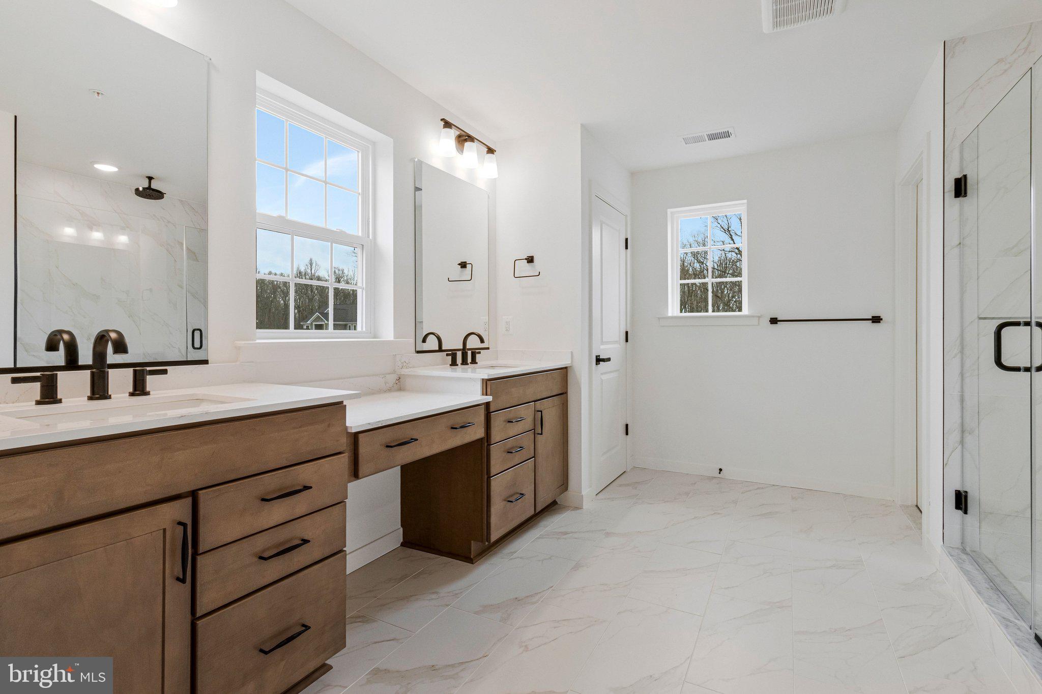 2013 St James Road Accokeek, MD 20607 - Photo 58 of 80 a spacious bathroom with a granite countertop sink mirror and a