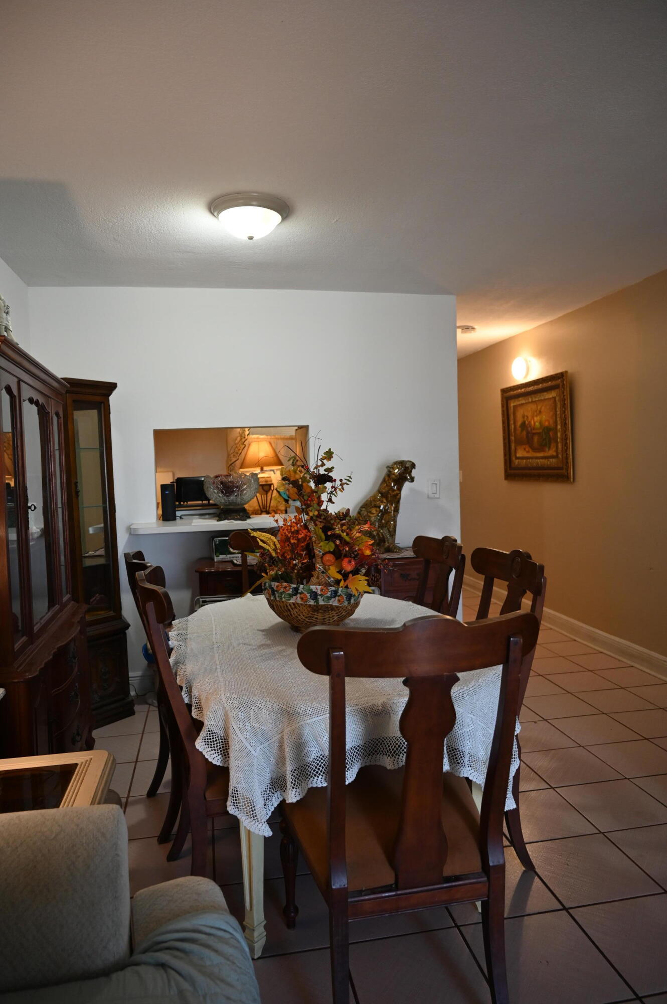 6215 West 20th Avenue, Unit 415 Hialeah, FL 33012 - Photo 16 of 39 a view of a dining room with furniture