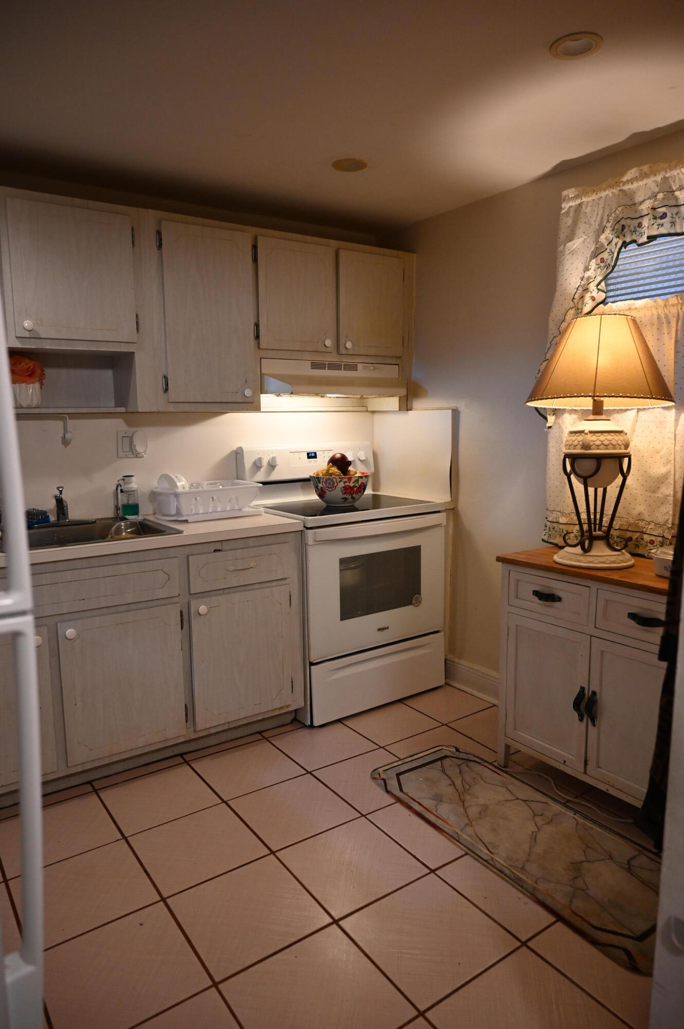 6215 West 20th Avenue, Unit 415 Hialeah, FL 33012 - Photo 18 of 39 a kitchen with a sink cabinets and appliances