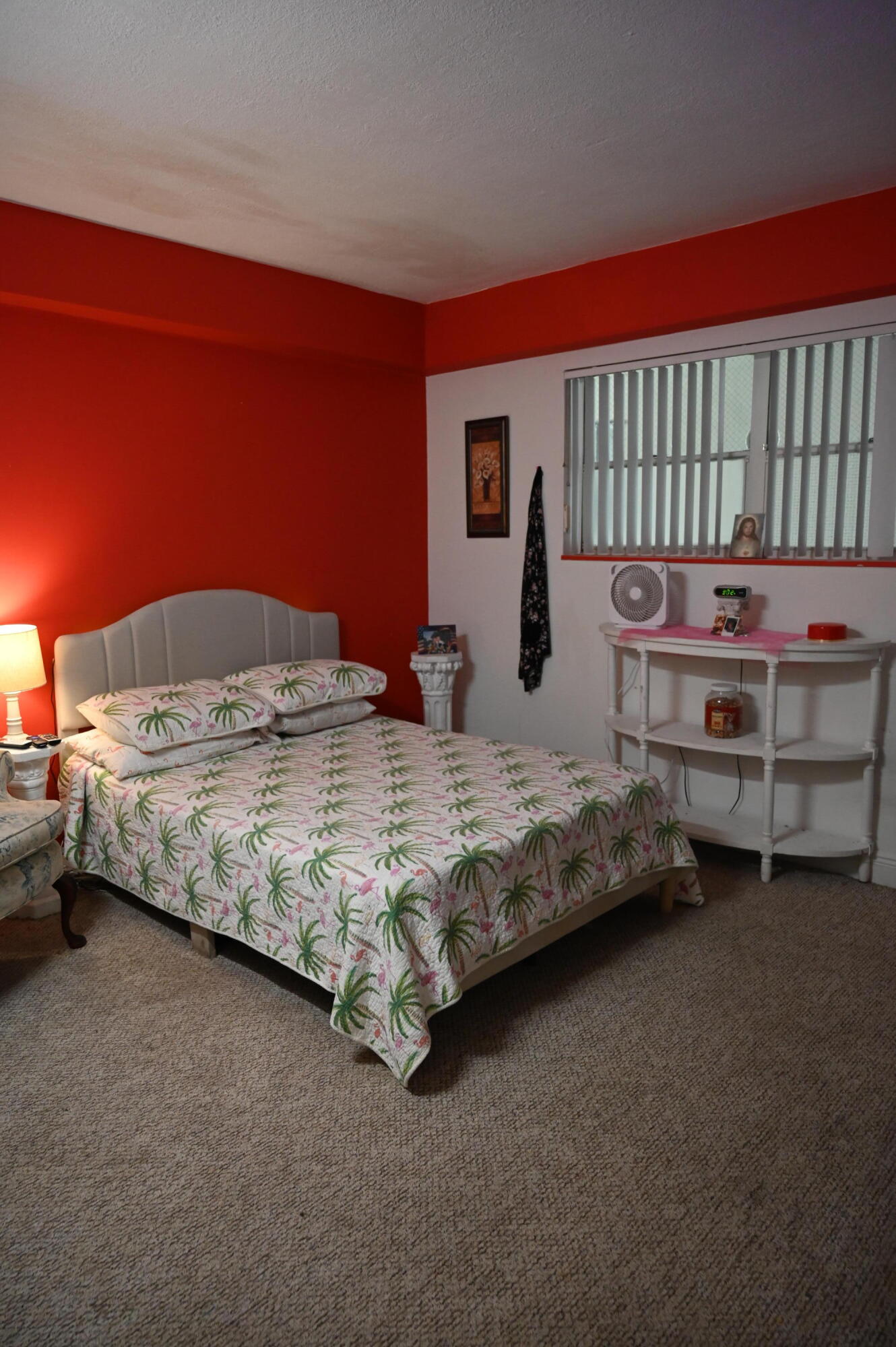 6215 West 20th Avenue, Unit 415 Hialeah, FL 33012 - Photo 25 of 39 a bedroom with a bed and a night stand