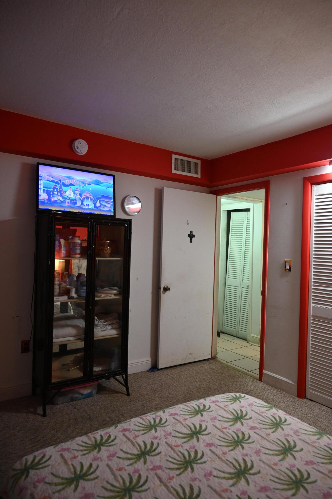 6215 West 20th Avenue, Unit 415 Hialeah, FL 33012 - Photo 27 of 39 a bedroom with a bed and a television