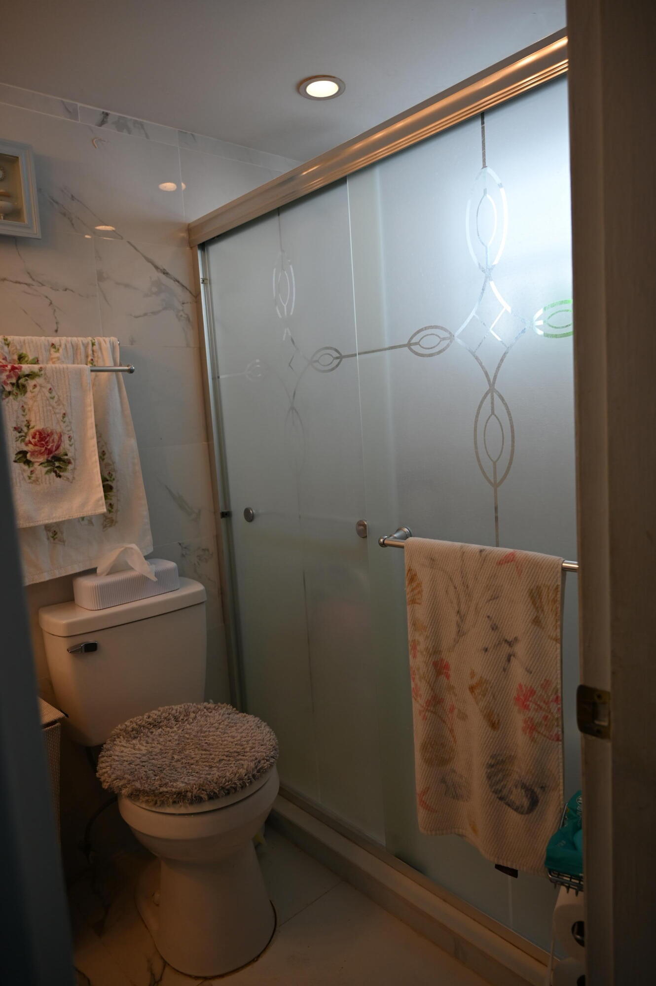 6215 West 20th Avenue, Unit 415 Hialeah, FL 33012 - Photo 28 of 39 a bathroom with a toilet and a shower