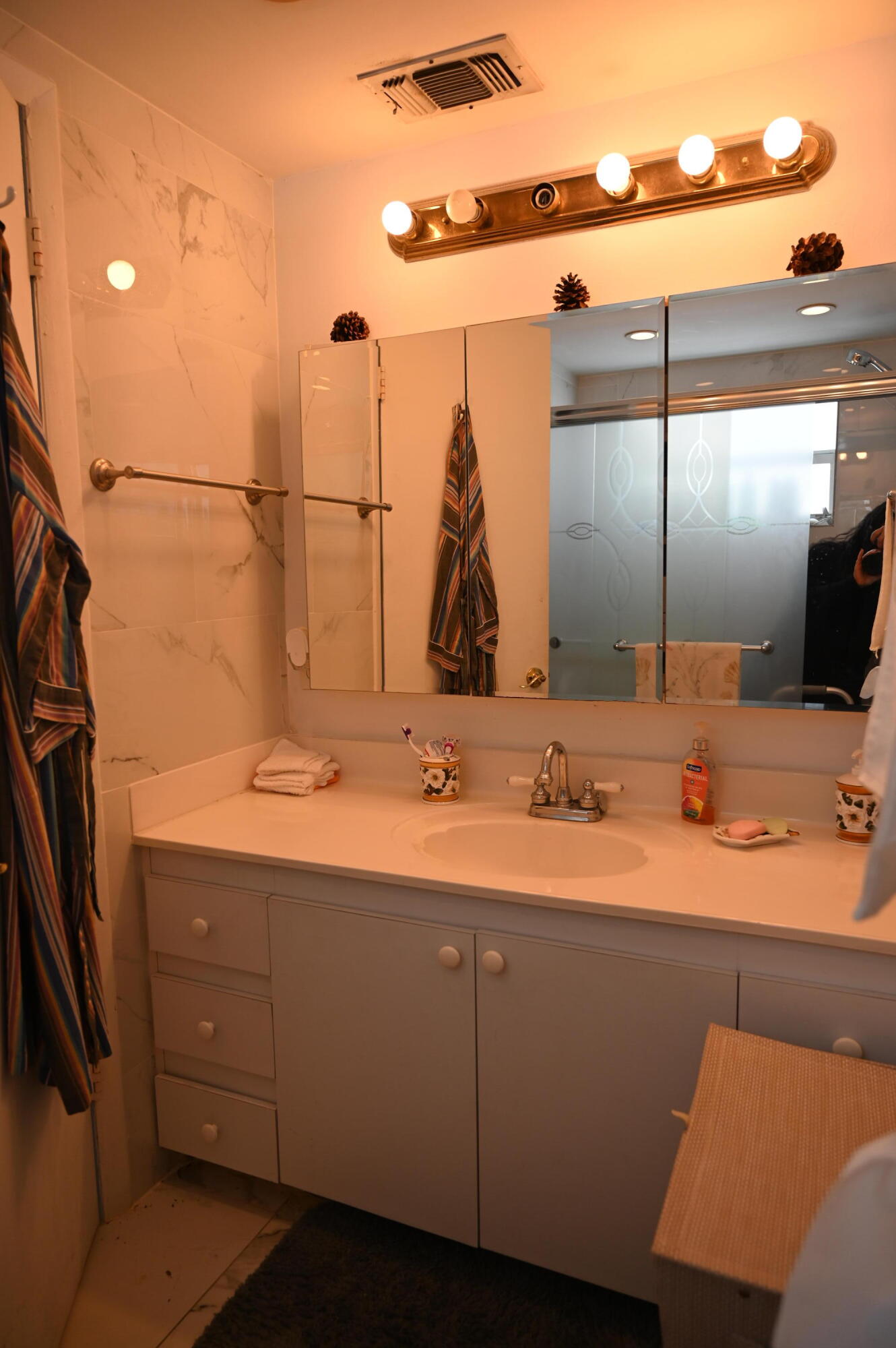 6215 West 20th Avenue, Unit 415 Hialeah, FL 33012 - Photo 31 of 39 a bathroom with a double vanity sink and a mirror