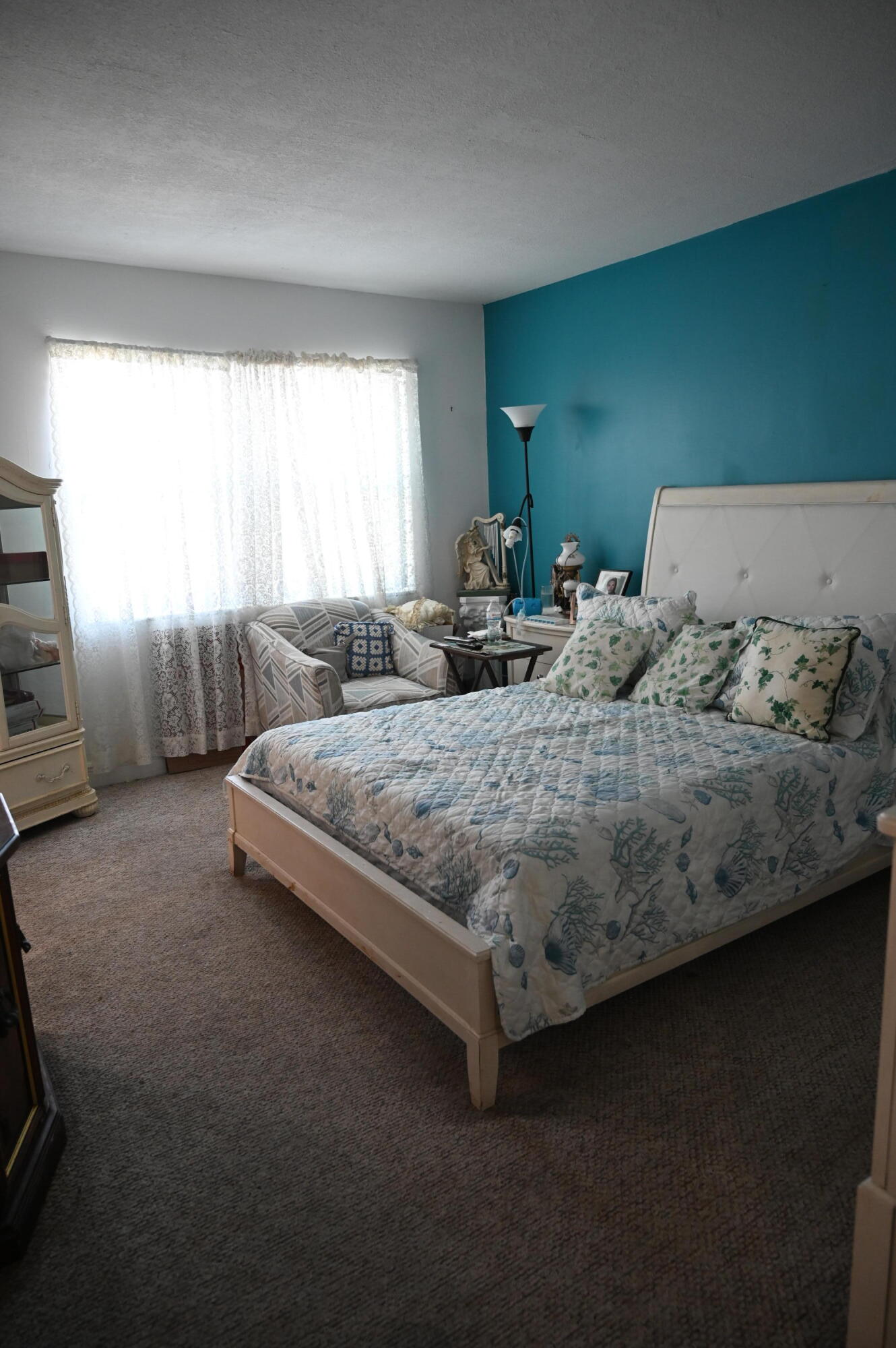 6215 West 20th Avenue, Unit 415 Hialeah, FL 33012 - Photo 32 of 39 a bedroom with bed and window