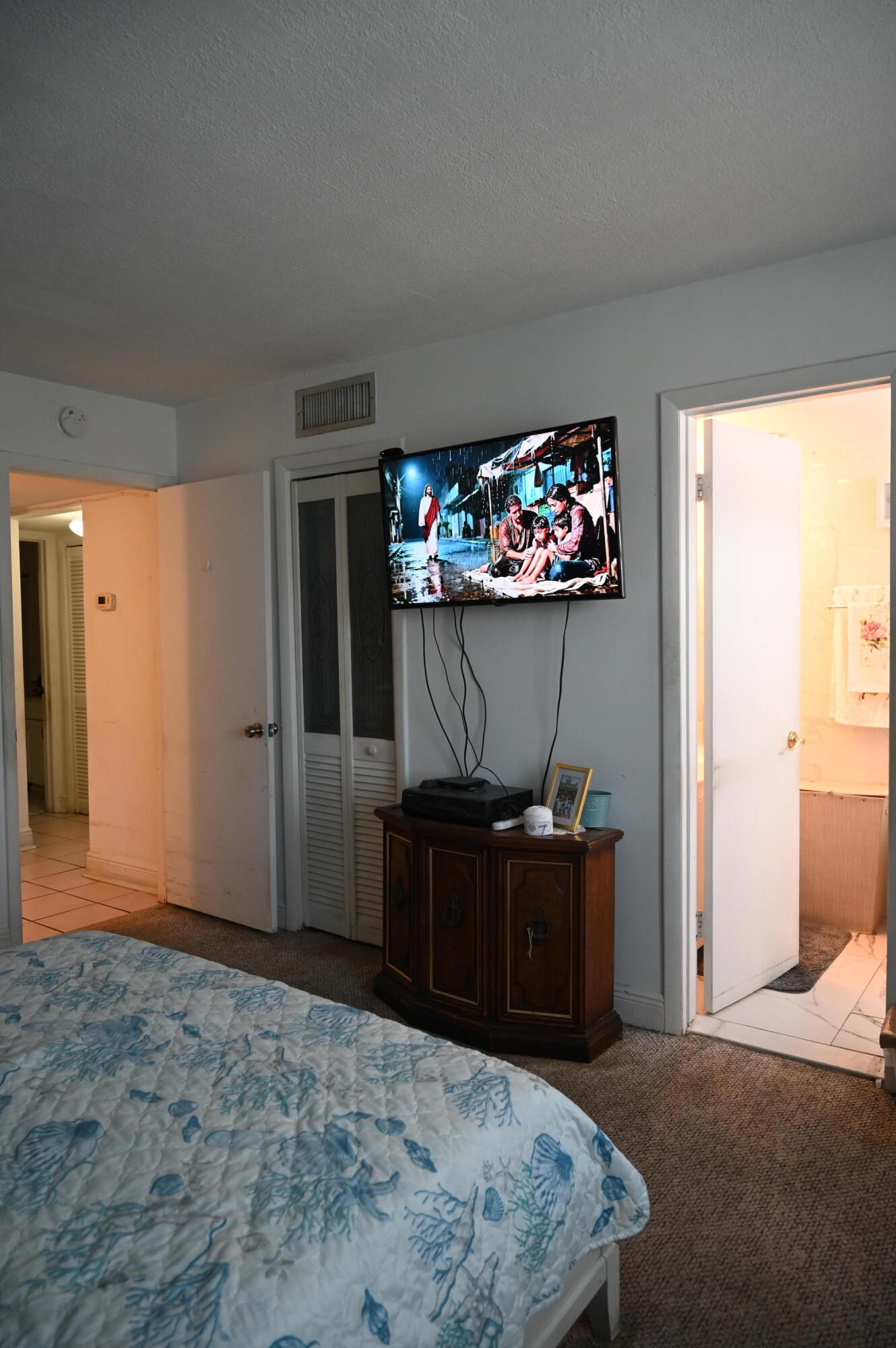 6215 West 20th Avenue, Unit 415 Hialeah, FL 33012 - Photo 33 of 39 a living room with furniture and a flat screen tv