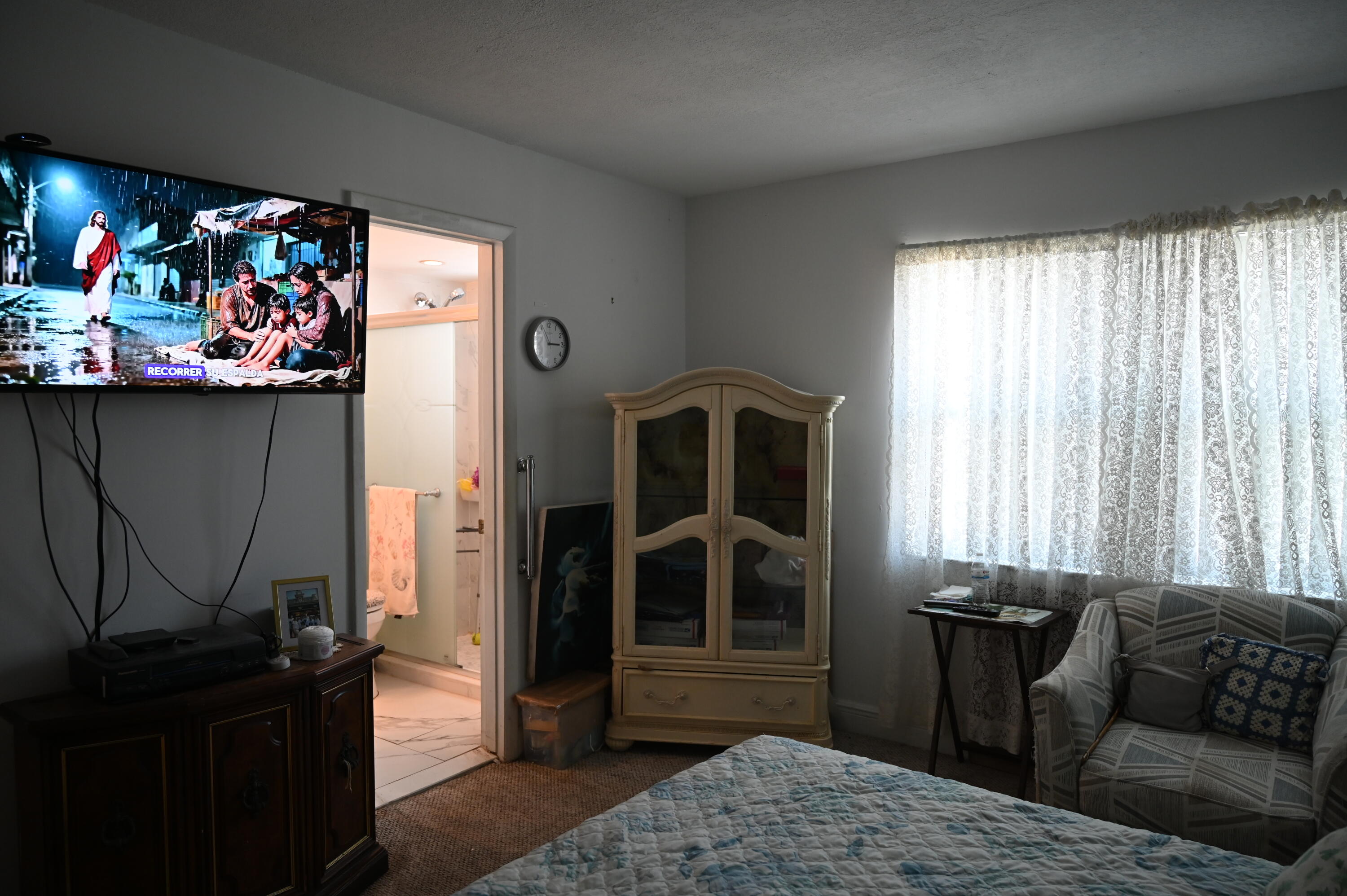 6215 West 20th Avenue, Unit 415 Hialeah, FL 33012 - Photo 34 of 39 a living room with furniture and a flat screen tv