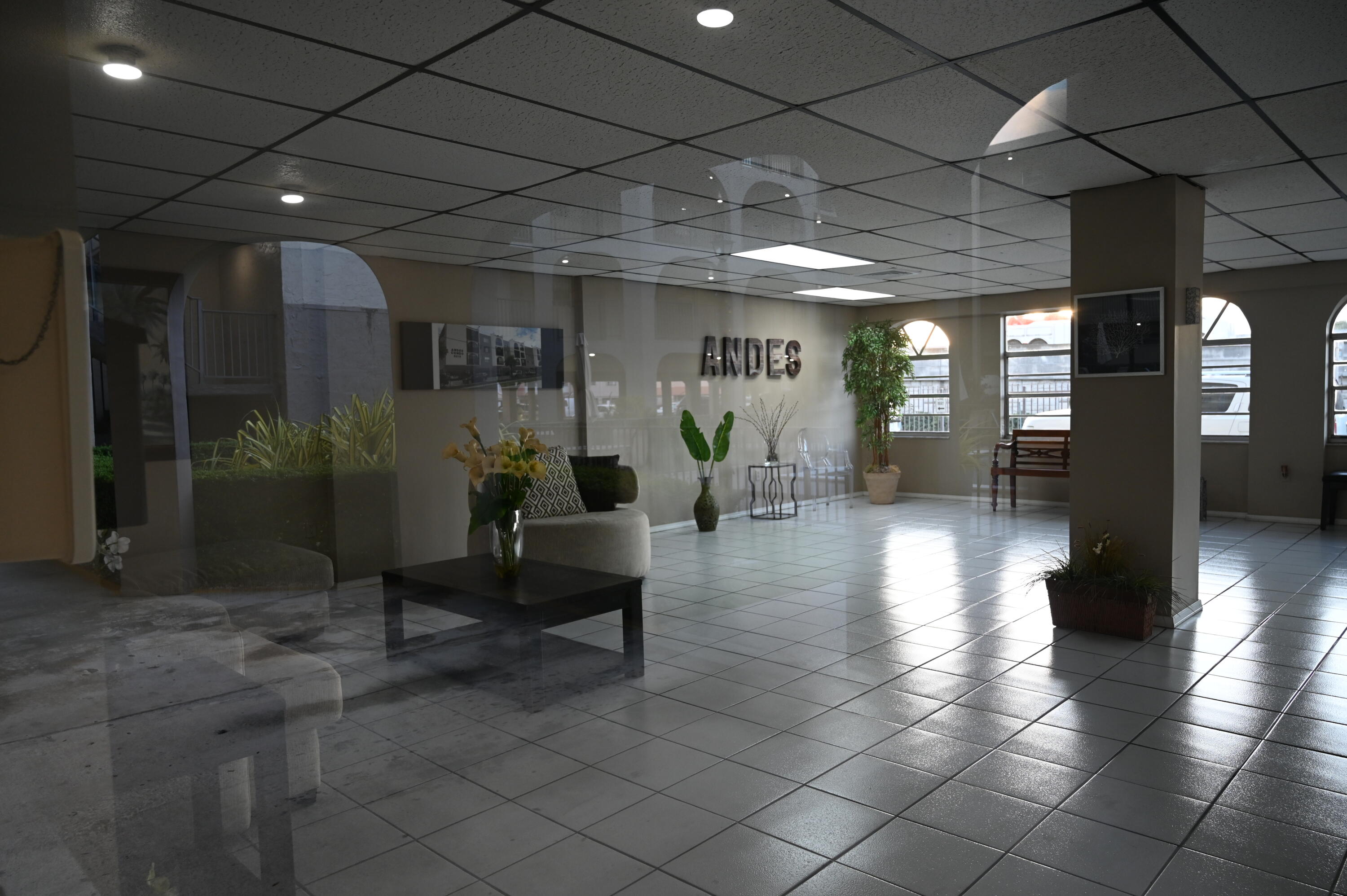 6215 West 20th Avenue, Unit 415 Hialeah, FL 33012 - Photo 39 of 39 a lobby with furniture and a glass door
