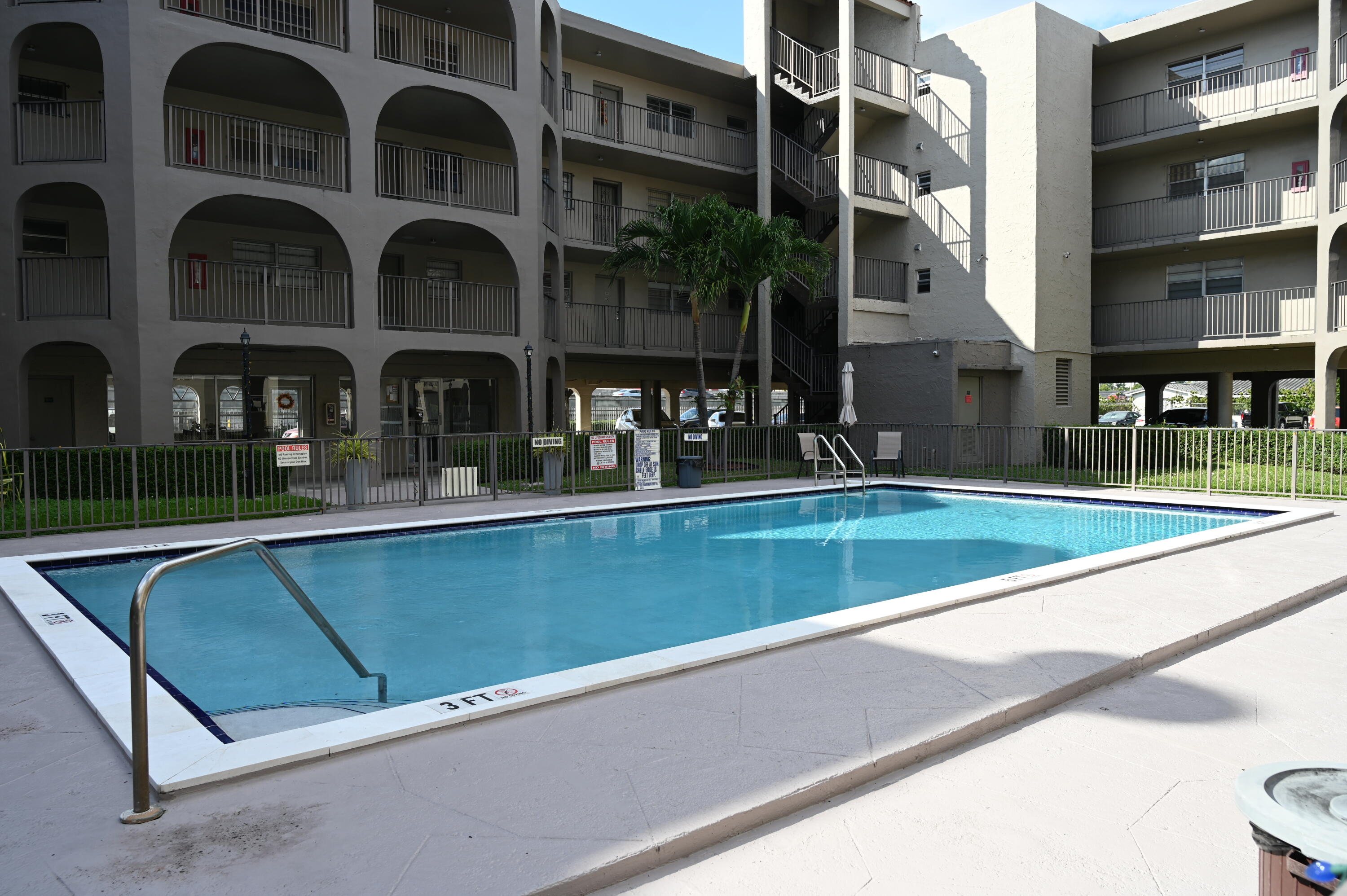 6215 West 20th Avenue, Unit 415 Hialeah, FL 33012 - Photo 6 of 39 a view of house with a yard