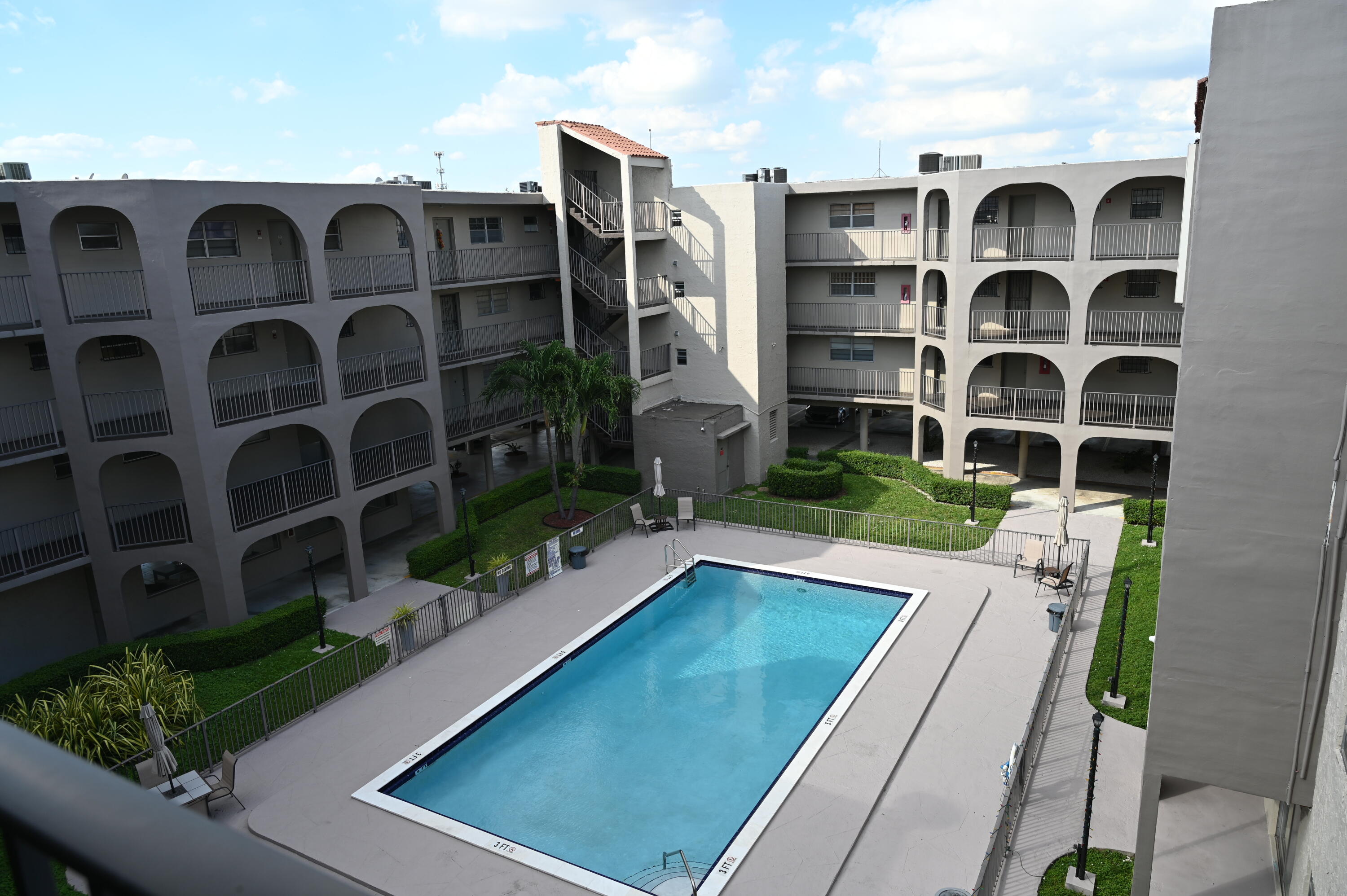 6215 West 20th Avenue, Unit 415 Hialeah, FL 33012 - Photo 7 of 39 a view of a backyard with door