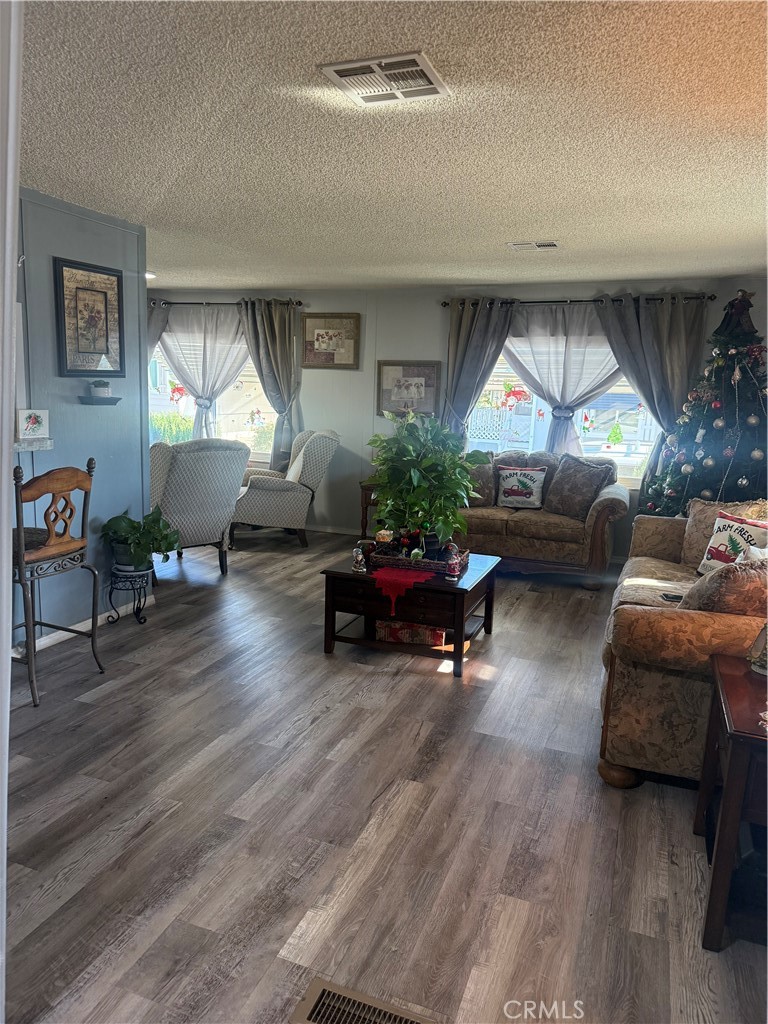 13393 Mariposa Road, Unit 97 Victorville, CA 92395 - Photo 3 of 32 a living room with furniture and a window