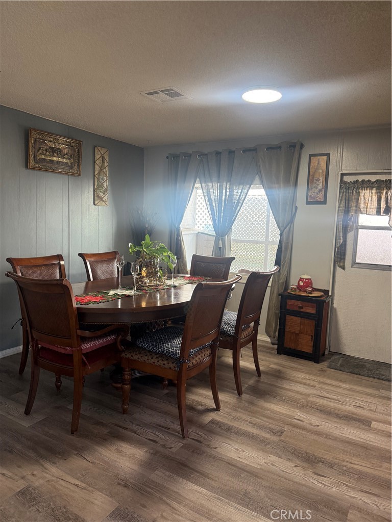 13393 Mariposa Road, Unit 97 Victorville, CA 92395 - Photo 7 of 32 a view of a dining room with furniture and window