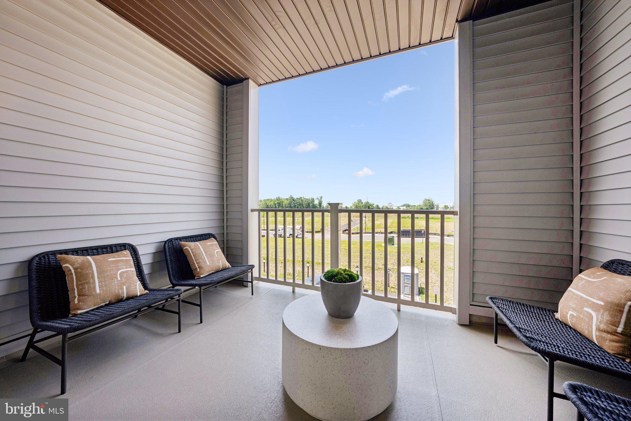 6709 Belcrest Road Hyattsville, MD 20782 - Photo 11 of 27 a balcony with chairs and with outdoor space