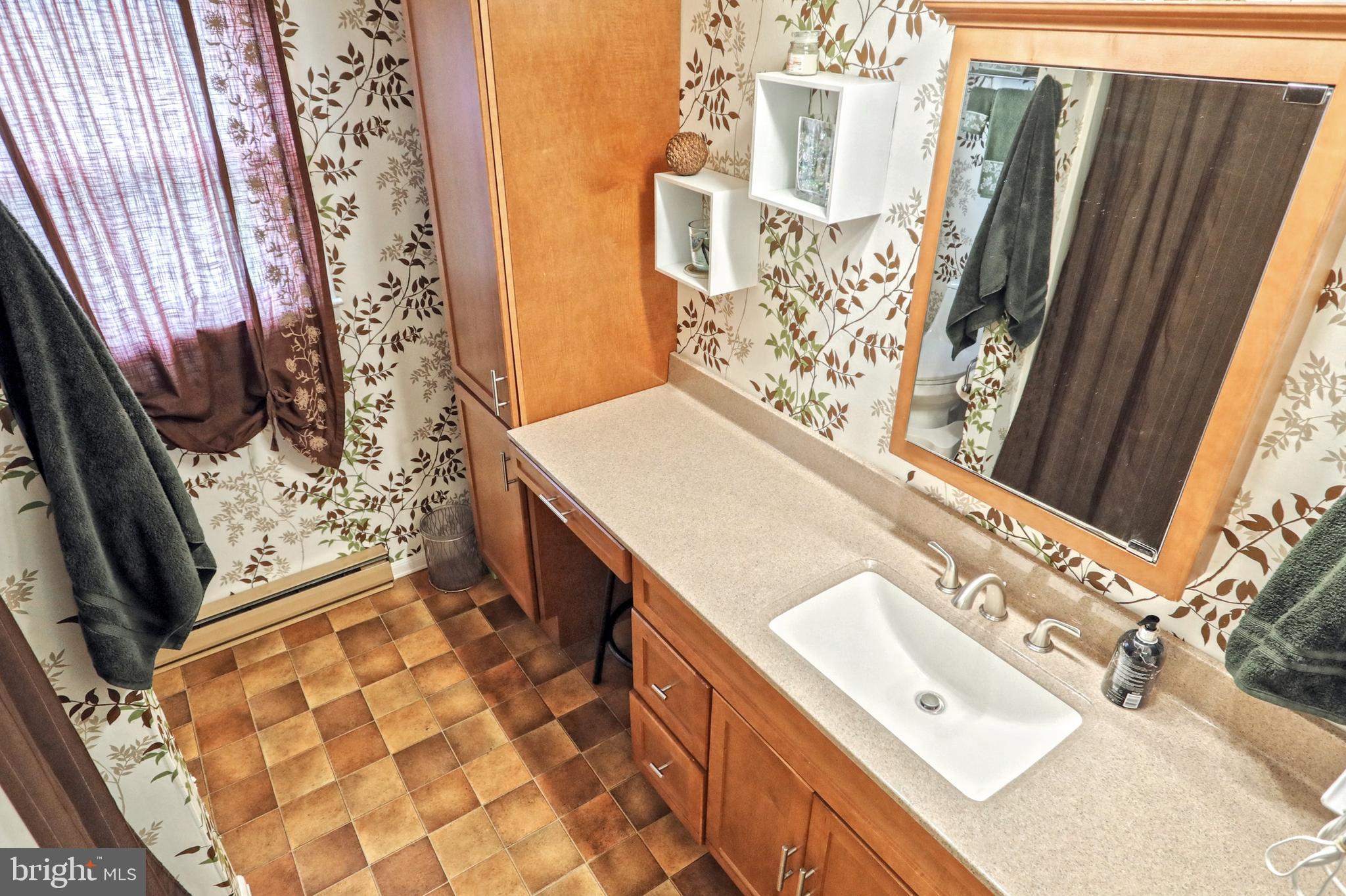 1775 Cemetery Road York, PA 17408 - Photo 24 of 59 a bathroom with a sink mirror vanity and toilet