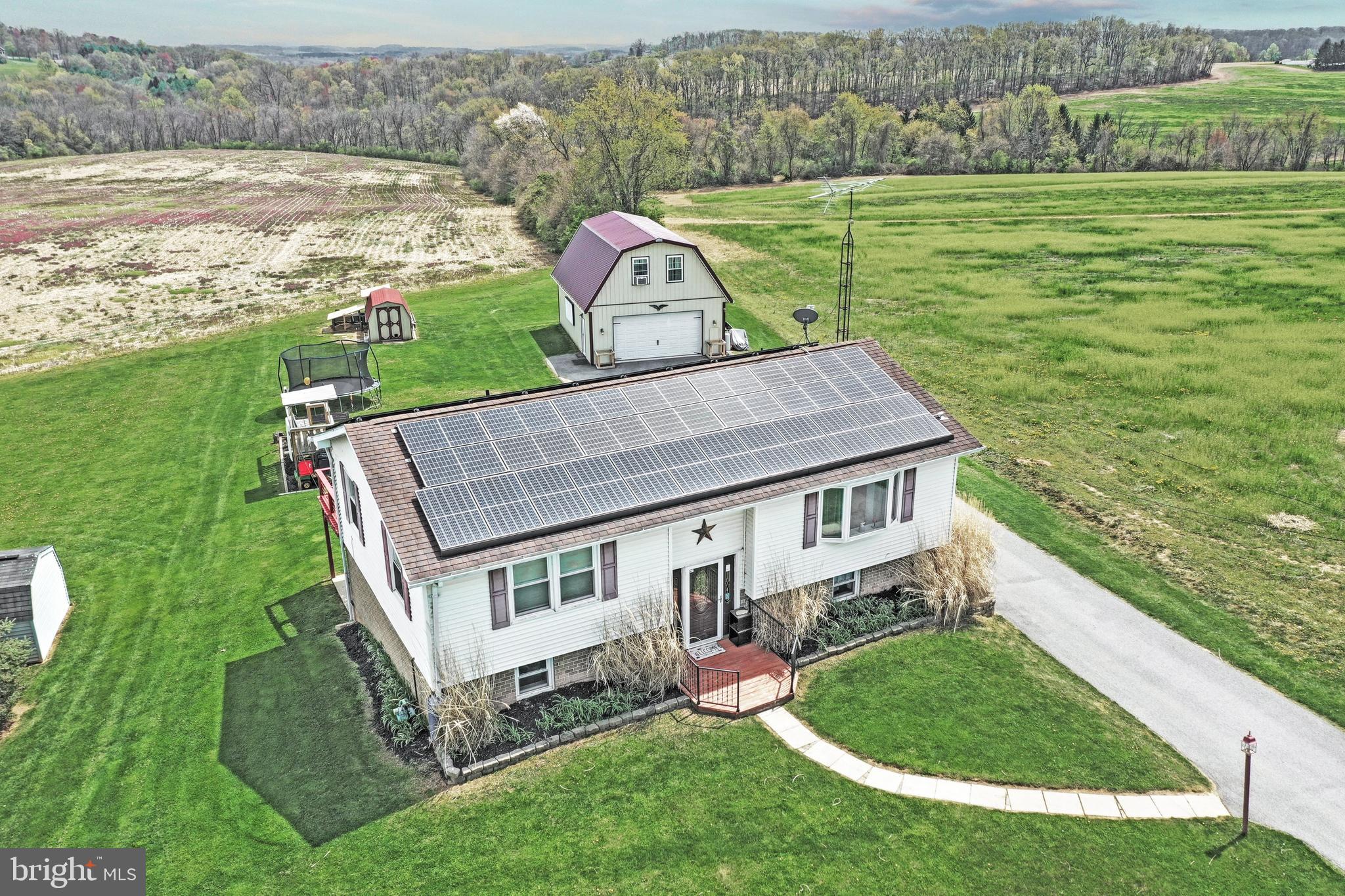 1775 Cemetery Road York, PA 17408 - Photo 50 of 59 a aerial view of a house with a yard table and chairs