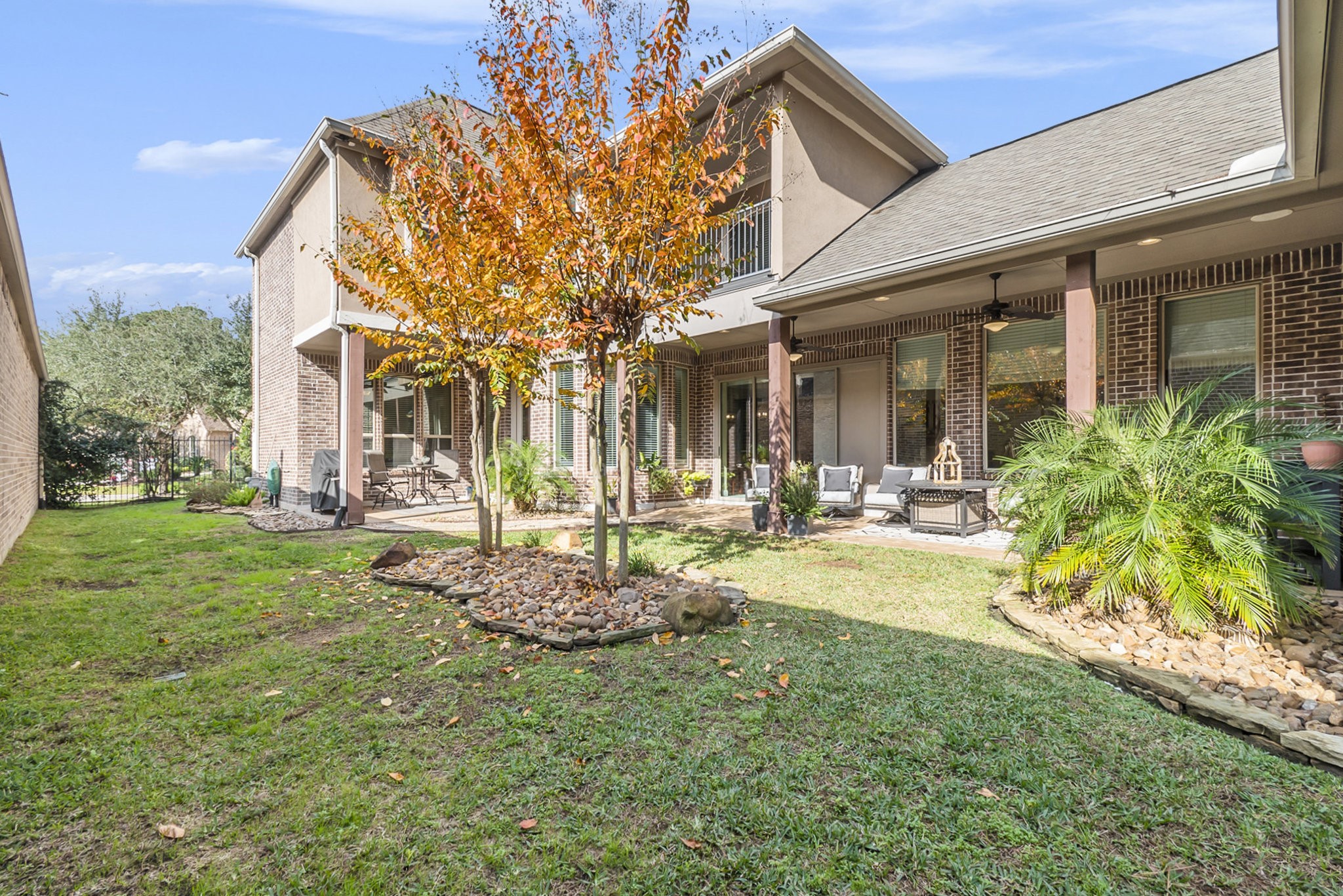 42 Sundown Ridge Place Tomball, TX 77375 - Photo 37 of 48 a view of a house with backyard and sitting area