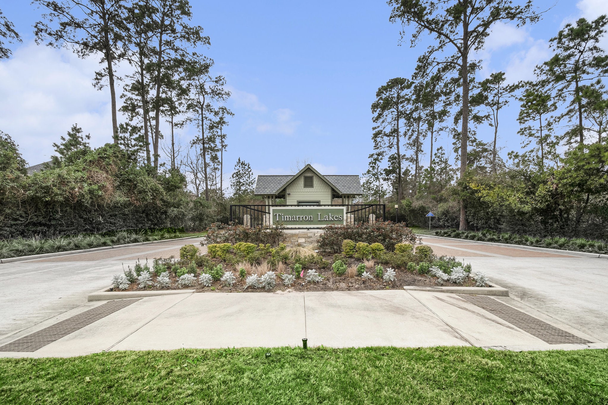 42 Sundown Ridge Place Tomball, TX 77375 - Photo 40 of 48 a front view of a house with a yard and trees