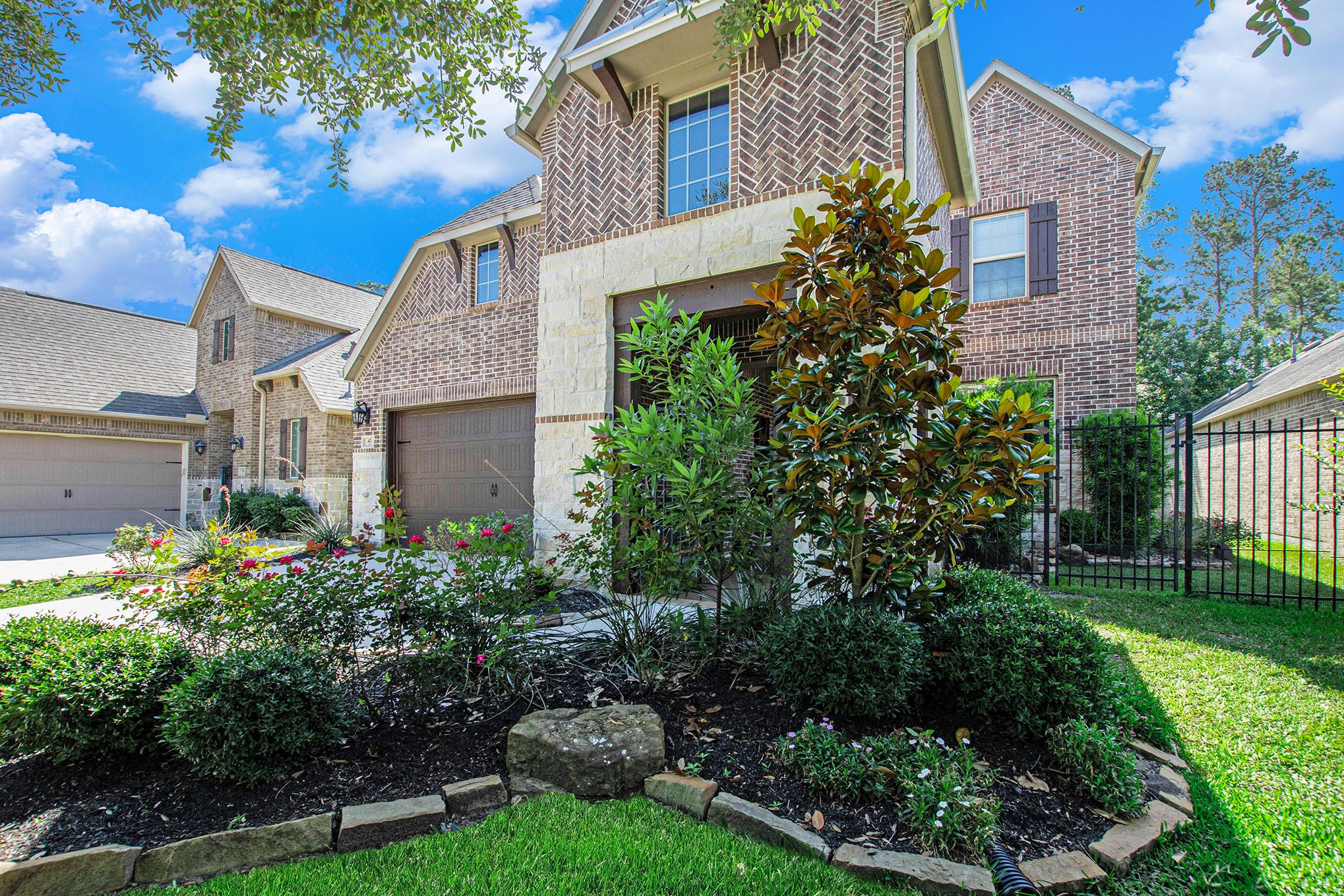 42 Sundown Ridge Place Tomball, TX 77375 - Photo 4 of 48 a front view of a house with a garden