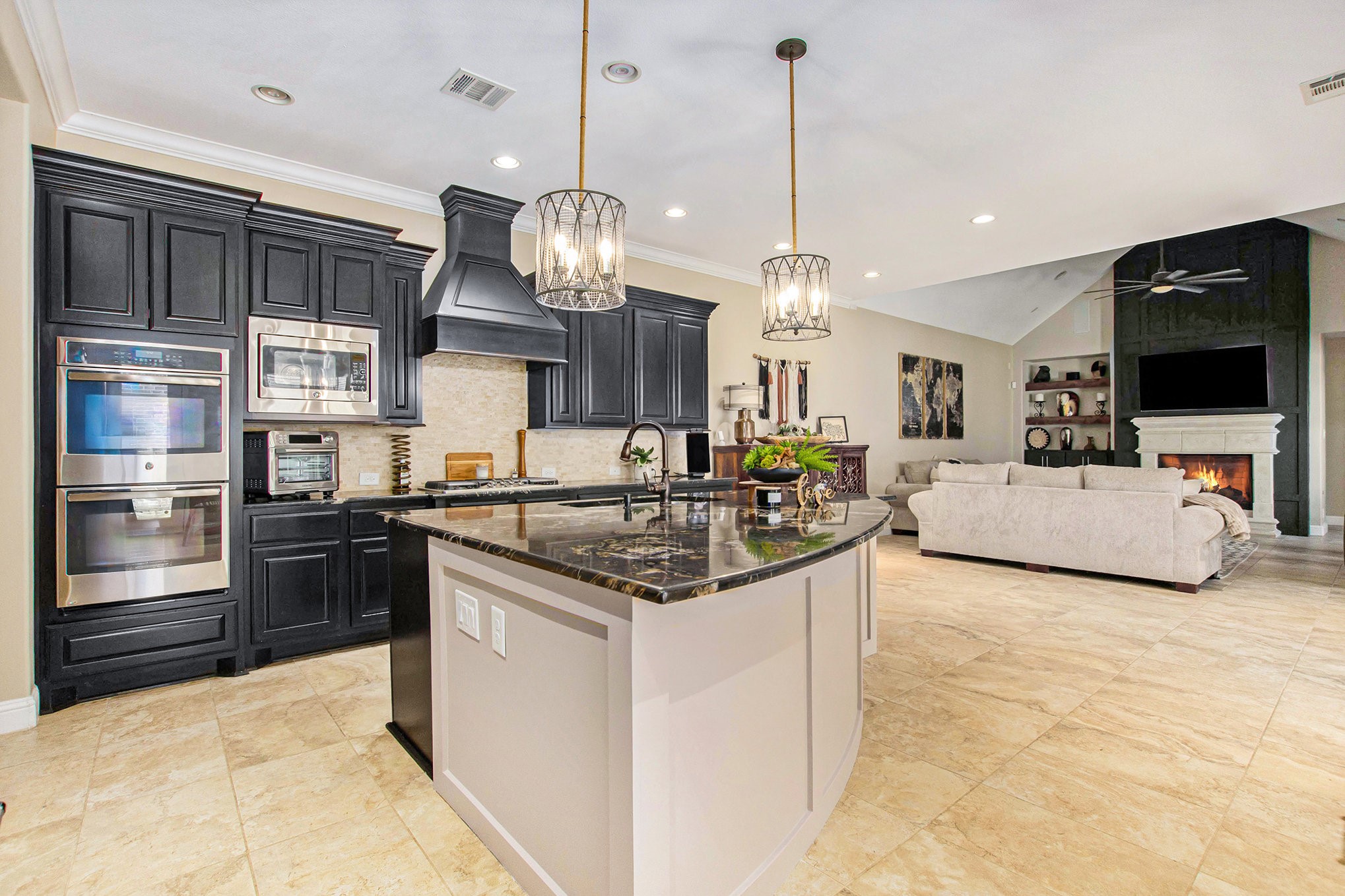 42 Sundown Ridge Place Tomball, TX 77375 - Photo 7 of 48 a kitchen with stainless steel appliances granite countertop a stove and a view of living room