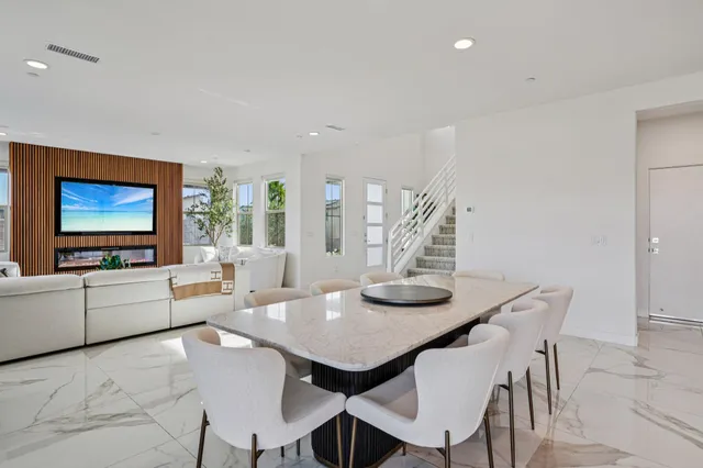 a bathroom with a granite countertop sink toilet a mirror and shower