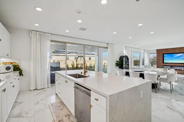 a spacious bathroom with a double vanity sink and a mirror
