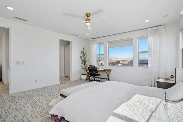 a bed room with a bed and a window