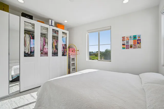 a view of a house with a porch and furniture