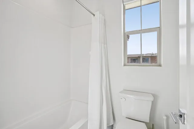 an aerial view of residential building and parking space