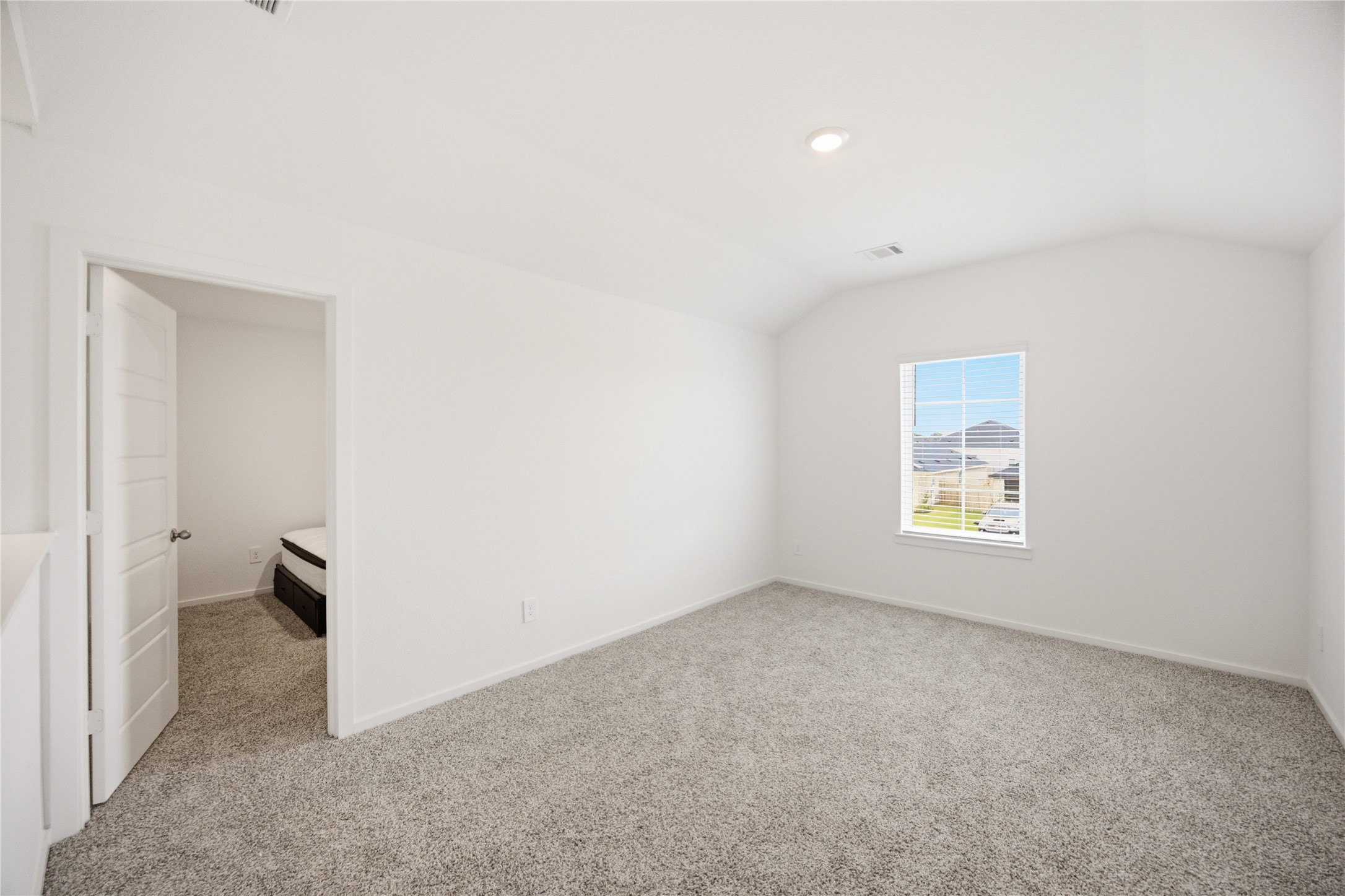 7 Robin Court Angleton, TX 77515 - Photo 21 of 27 Media room view — Additional angle of the upstairs media room showing its spacious, versatile layout.