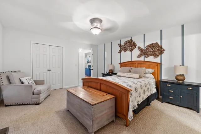 a bedroom with a bed and a couch