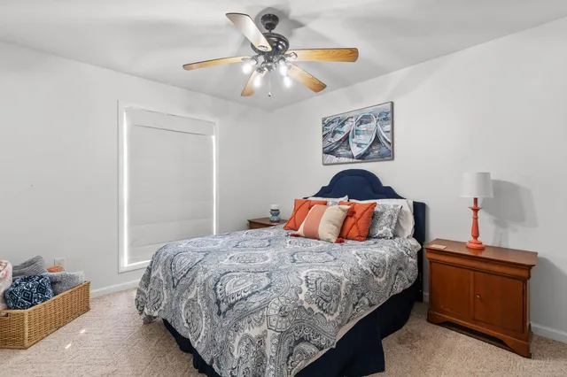 a bedroom with a bed and dresser