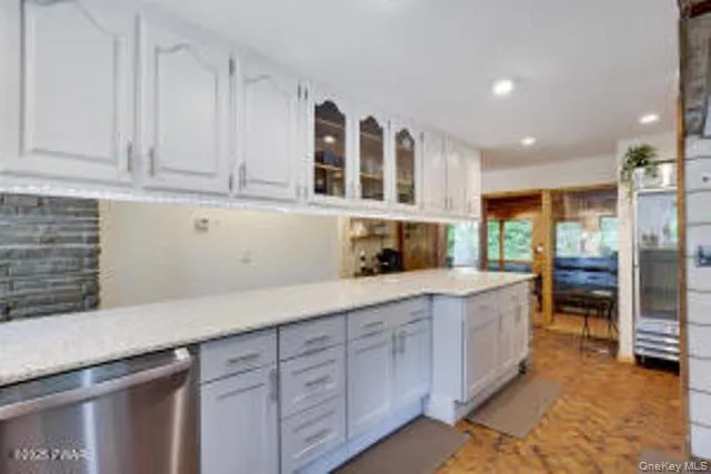 a kitchen with stainless steel appliances granite countertop a sink and cabinets