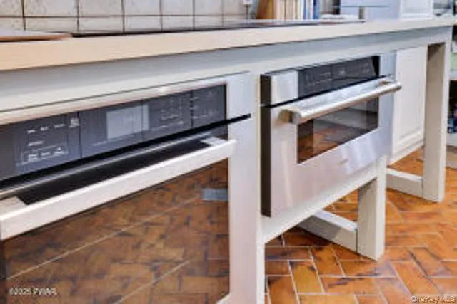 a kitchen with a stove and a microwave