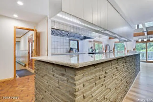 a view of a living room and bathroom