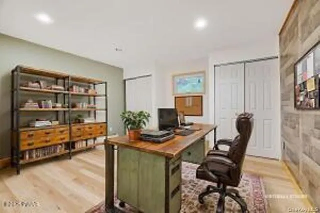 a workspace with furniture and window