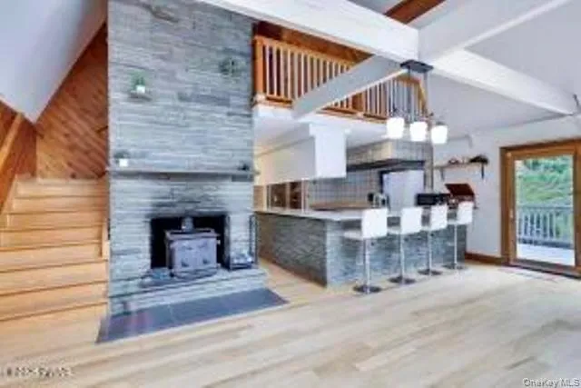 a dining room with a fireplace and entryway
