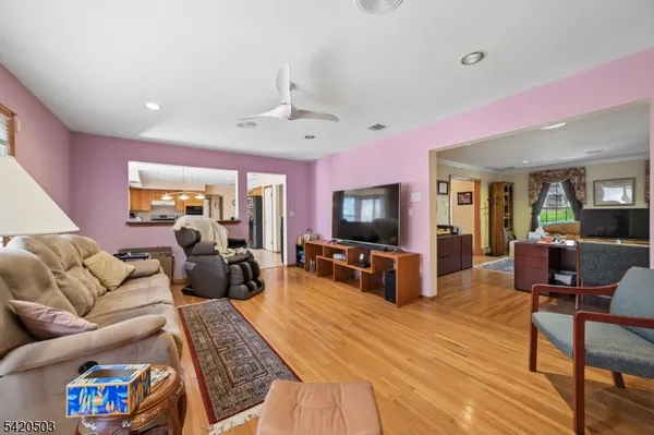 a kitchen with stainless steel appliances granite countertop a stove top oven a refrigerator a sink and dishwasher