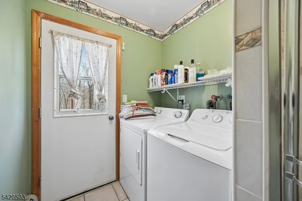 a bathroom with a granite countertop sink mirror and a toilet