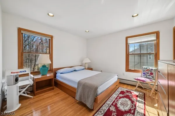 a bedroom with a large bed and a large window