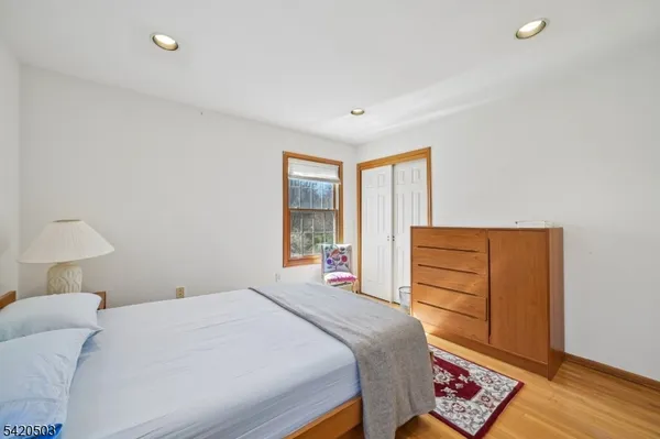 a view of a patio with table and chairs with wooden floor and fence