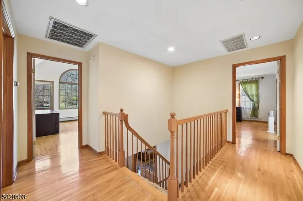 a view of a house with backyard and a tree