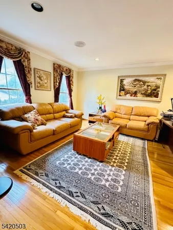 a living room with furniture and a rug