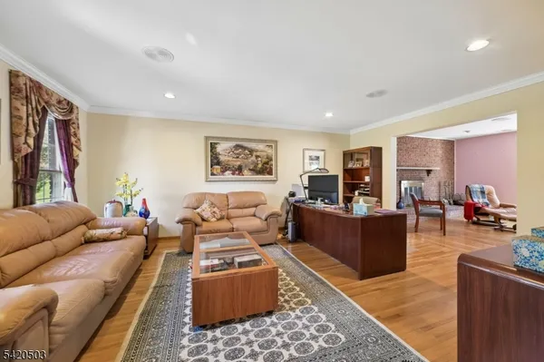 a living room with furniture rug and wooden floor