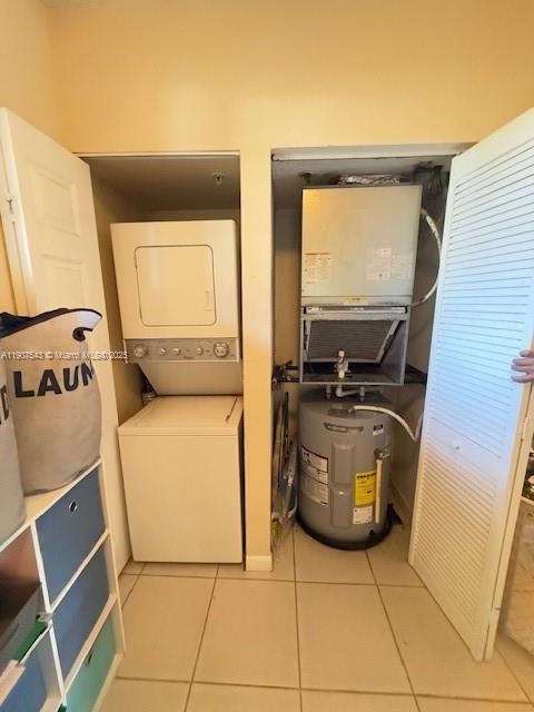 1967 Marsh Harbor Drive, Unit 313 Riviera Beach, FL 33404 - Photo 11 of 18 a utility room with dryer and washer