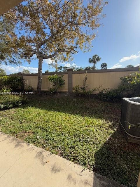 1967 Marsh Harbor Drive, Unit 313 Riviera Beach, FL 33404 - Photo 8 of 18 a view of a pathway with a wrought fence