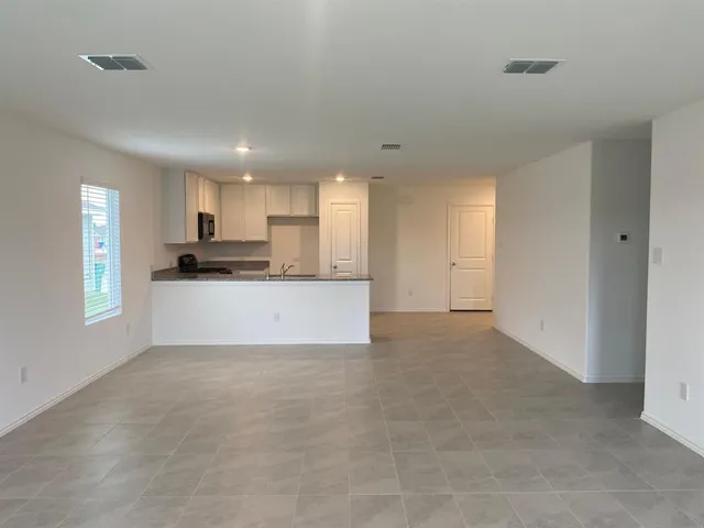 a kitchen with cabinets and stainless steel appliances