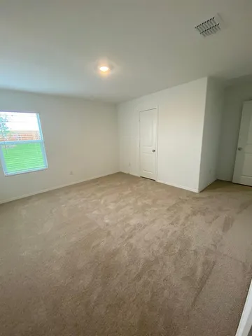 a utility room with a sink a vanity and mirror