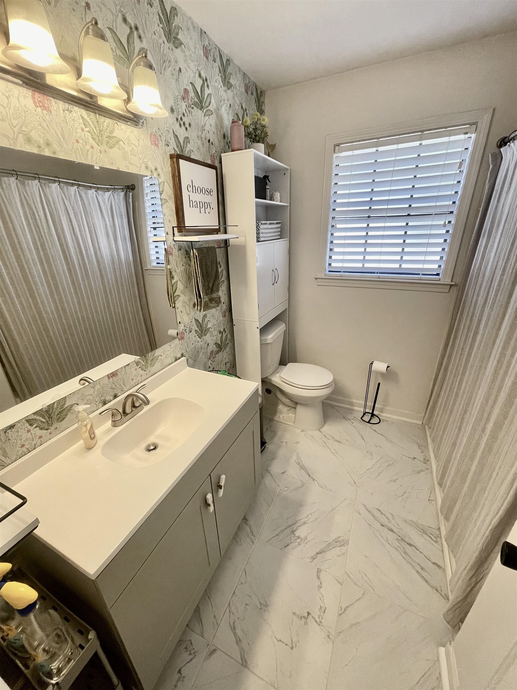 384 Fletcher Hollow Road Collierville, TN 38017 - Photo 14 of 17 a bathroom with a sink mirror and toilet