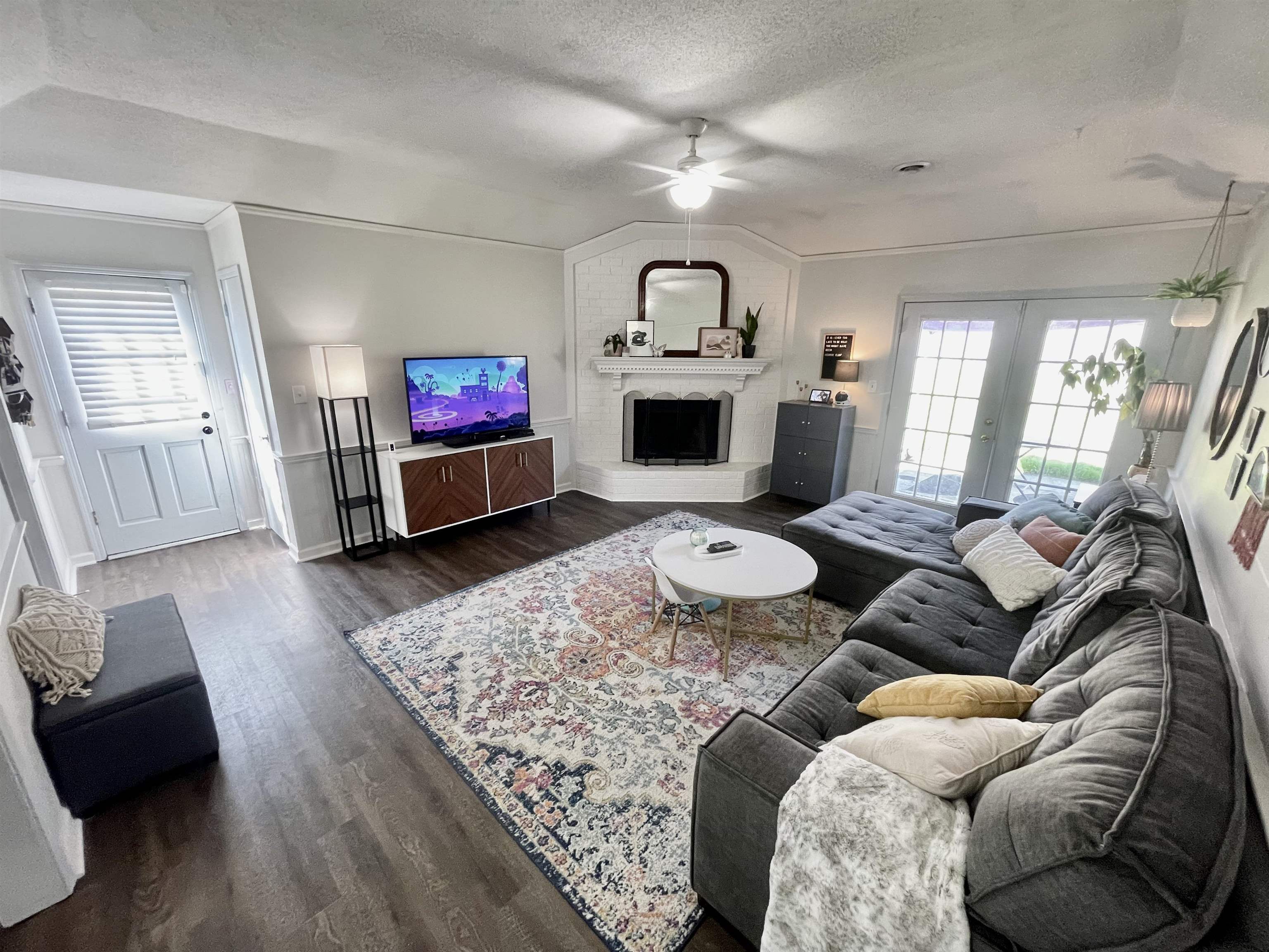 384 Fletcher Hollow Road Collierville, TN 38017 - Photo 3 of 17 a living room with furniture and a flat screen tv