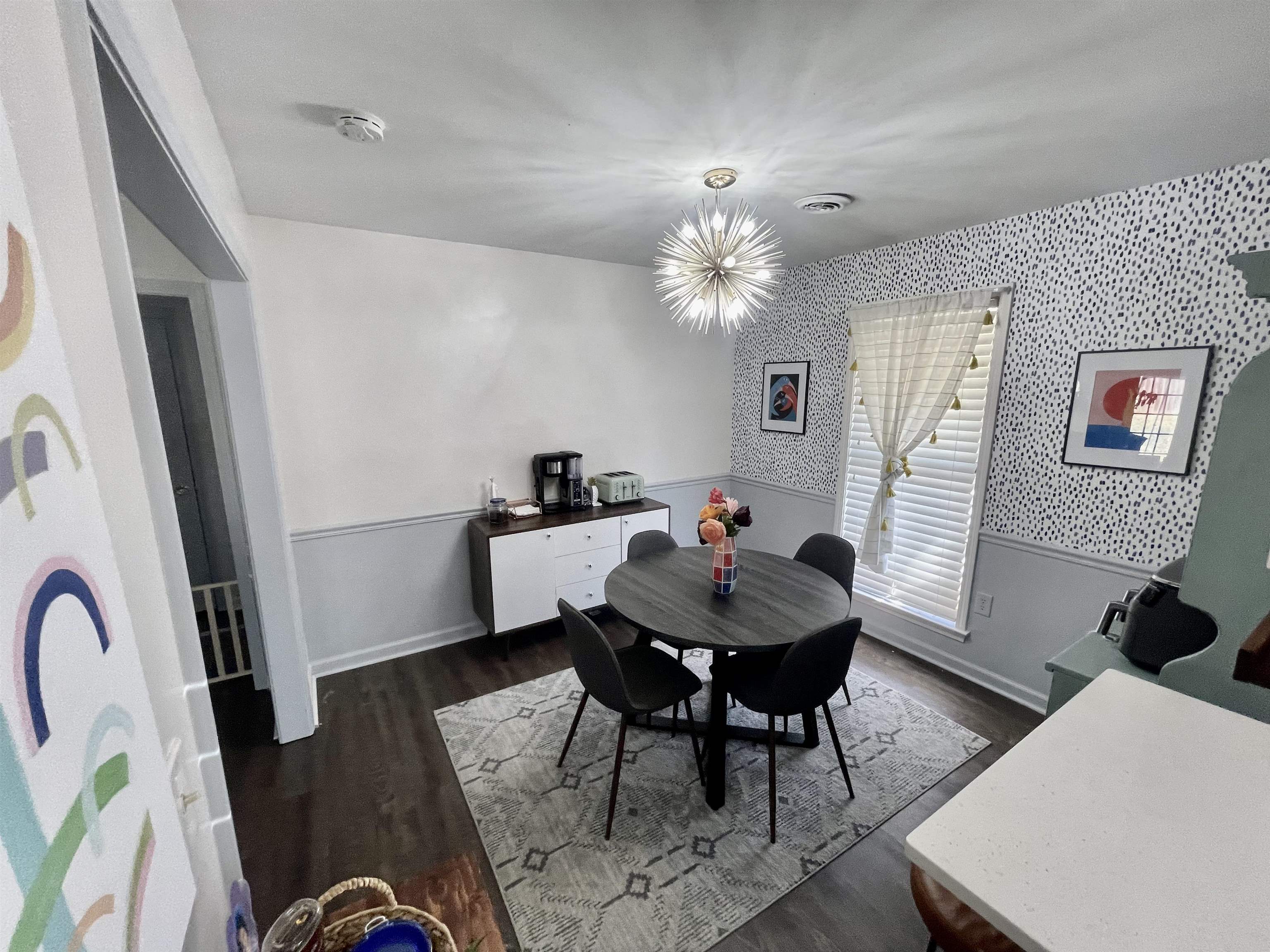 384 Fletcher Hollow Road Collierville, TN 38017 - Photo 7 of 17 a view of a dining room with furniture and wooden floor