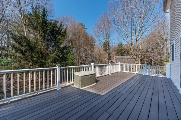 a view of deck with wooden floor and fence
